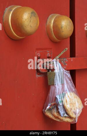 containing food plastic bag hang at the door, beijing, china Stock Photo