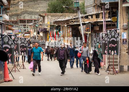 India, Jammu & Kashmir, Kargil main bazaar, crowds for Ashura, Muharram festival in side road Stock Photo