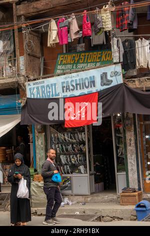 India, Jammu & Kashmir, Kargil old bazaar, shoe and fashion shop in historic building Stock Photo