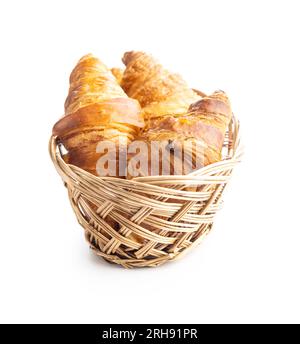 Fresh butter croissant in basket isolated on the white background. Stock Photo