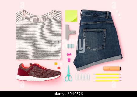 Getting ready for school flat lay, womens clothing. Back to school flat lay on pink background Stock Photo