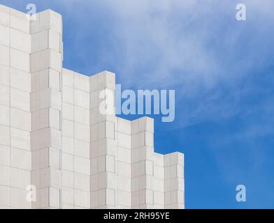 Wall of high building decorated white marble tiles щт ифслпкщгтв ща идгу ылню Stock Photo
