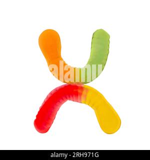Letter X made of multicolored gummi worms and isolated on pure white background. Food alphabet concept. One letter of the set of sweet food font easy Stock Photo