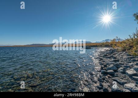 Autumn season in Abisko with Lake Tornetraesk in background, taken from Bjoerkliden, Swedish Lapland, Sweden. Stock Photo