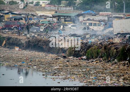 Electronic scrap processing in Agbogbloshie takes place in the district of the same name in the metropolis of Accra in West African Ghana. Dump, Waste Stock Photo