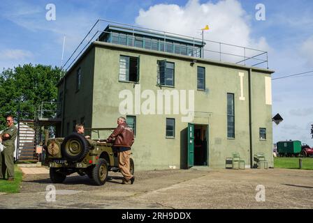 Rougham Control Tower with Aviation Museum, dedicated to the American Airmen / women who served in the Second World War. Willys Jeep & re-enactors Stock Photo