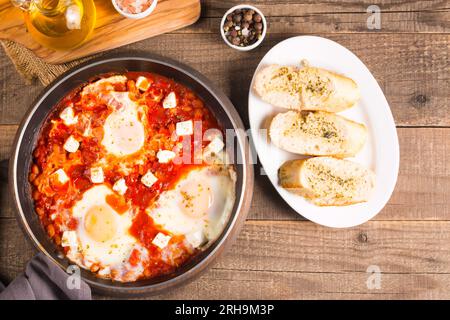 Shakshuka made of poached eggs in tomato pepper sauce Stock Photo