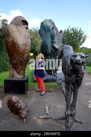 Silke Lohmann prepares a collection of animal sculptures during a photo call in Billinghurst, West Sussex, for Summers Place Auctions's sale of an exceptional private collection of Contemporary British sculpture which takes place on September 26. The 72 lots include small sculptures for the home as well as monumental sculptures. Picture date: Tuesday August 15, 2023. Stock Photo