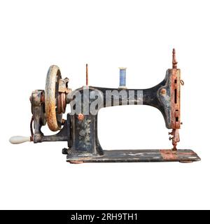 Vintage weathered and rusted sewing machine isolated on a white background Stock Photo