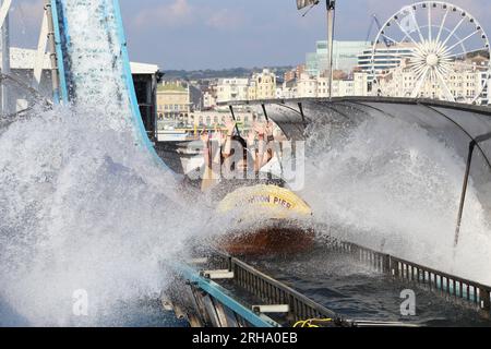 BRIGHTON, GREAT BRITAIN - SEPTEMBER 16, 2014: Visitors have fun at the water attractions at the Brighton Pier. Stock Photo