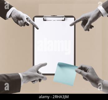 Corporate business people working together and pointing at a blank clipboard, a woman is holding a sticky note, collaboration and teamwork concept Stock Photo