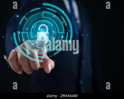 Businessman finger pressing on virtual key. Represents protection from outside hacking. The concept of code protection. Viruses, firmware and malware. Stock Photo