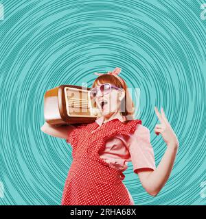 Funny retro style woman carrying a vintage radio on her shoulder and listening to music, she is dancing and singing Stock Photo