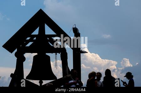 Oberwiesenthal, Germany. 15th Aug, 2023. Thunderclouds pile up behind the Peace Bell on the Fichtelberg. The 1215-meter-high mountain is an attraction for numerous vacationers in the region in summer as well as in winter. Credit: Hendrik Schmidt/dpa/Ģ����ý Live News Stock Photo