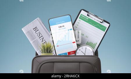 Financial graphs and business items in a briefcase: stock market, investments and trading concept Stock Photo