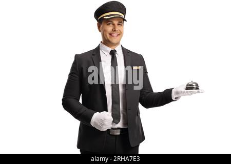 Bellboy holding a reception bell isolated on white background Stock Photo