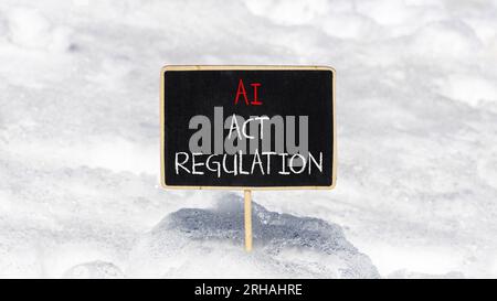 AI act regulation symbol. Concept words AI artificial intelligence act regulation on beautiful black chalk blackboard. Beautiful snow background. Busi Stock Photo