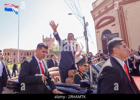 Paraguay, Asunción: 15 August 2023,  Santiago Peña (m) and his wife Leticia Ocampos (m, r) wave to the crowd after Peña was sworn in as the new president of Paraguay. Photo: Nathalia Aguilar/dpa Stock Photo