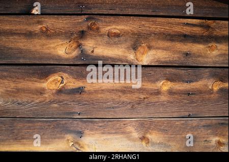 The beautiful grain and patina of an old weathered wall still intact on an abandoned cabin high in the Colorado mountains. Stock Photo