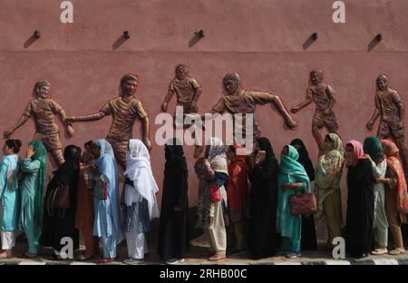 Srinagar, India. 15th Aug, 2023. August 15, 2023, Srinagar Kashmir, India : People queue outside Bakshi Stadium to attend India's 77th Independence Day celebrations in Srinagar. On August 15, 2023 in Srinagar Kashmir, India. (Photo By Firdous Nazir/Eyepix Group) Credit: Eyepix Group/Alamy Live News Stock Photo