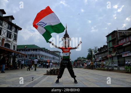 Srinagar, India. 15th Aug, 2023. August 15, 2023, Srinagar Kashmir, India : A supporter of Akhil Bharatiya Vidyarthi Parishad (ABVP) waves India's national flag during India's 77th Independence Day celebrations in Srinagar. On August 15, 2023 in Srinagar Kashmir, India. (Photo By Firdous Nazir/Eyepix Group) Credit: Eyepix Group/Alamy Live News Stock Photo