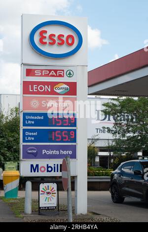 Slough, Berkshire, UK. 15th August, 2023. Petrol prices are starting to rise again at many petrol stations in England. Just a few weeks petrol was around 138.0 per litre. Today at the Esso petrol station in Cippenham, Slough, Berkshire, it was 153.9 per litre for petrol and 155.9 per litre for diesel. Credit: Maureen McLean/Alamy Live News Stock Photo