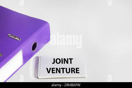 Handwriting text writing Joint Venture. Concept meaning Cooperation Arrangement, Partnership Group, White Background Stock Photo