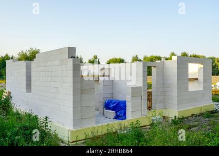 Single family house construction site, wall construction from concrete blocks, foundation insulation Stock Photo