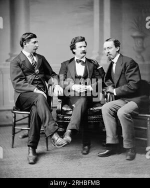 United States:  February 7, 1871 A studio portrait of (l-r):  Civil War correspondent and author George Townsend, author and humorist Mark Twain, and Buffalo Courier editor David Gray. Stock Photo