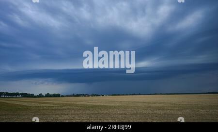 Petersdorf, Germany. 15th Aug, 2023. A thunderstorm cell moves with dark clouds over the east of the state of Brandenburg in the evening. Heavy thunderstorms passed over many regions in Germany on Tuesday. Credit: Patrick Pleul/dpa/Ģ����ý Live News Stock Photo