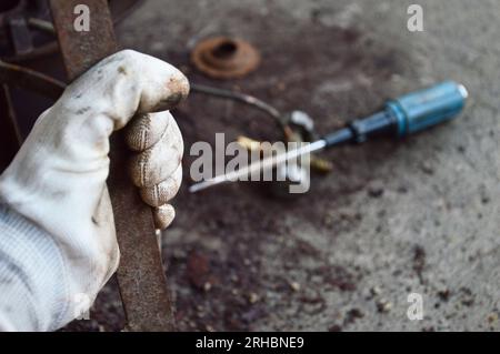 Scrub rusted steel that is stuck. Stock Photo