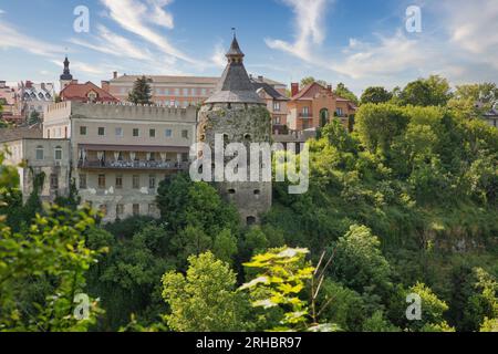 View over Kamianets-Podilskyi cityscape with old stone medieval Potter Tower over the Smotrytsky canyon, Ukraine. Stock Photo