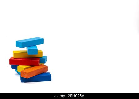 Blue and blue, yellow and red with orange wooden blocks for children's play stand turret. Isolate. High quality photo. For text. Stock Photo