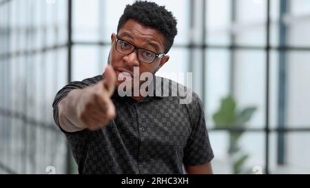 Indoor shot of a young confident black businessman looking serious Stock Photo