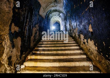 Old vaulted corridor of Soviet bunker, echo of Cold War. Stock Photo