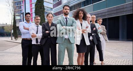 Team portrait serious multicultural professionals posing with confidence. Young mature colleagues. Stock Photo