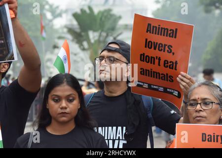 Non Exclusive: August 15, 2023, Kolkata, India. Animal lover activists hold a protest demonstration with symbolic human flesh in trays, a poignant vis Stock Photo