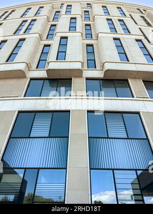 new modern office building with blue windows glass. closeup bottom view. Stock Photo