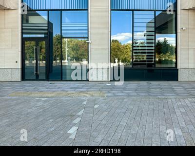 entrance of office building with street reflections. modern urban architecture. Stock Photo
