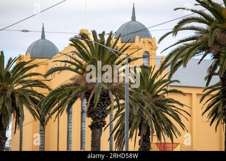 Façade of the historic Palais Theatre with palm trees in foreground. St Kilda, Victoria, Australia Stock Photo