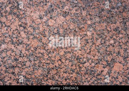 Closeup view of textured glossy pink granite slab Stock Photo