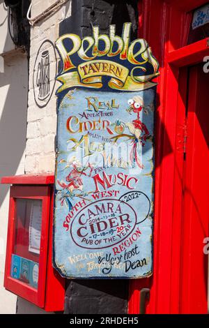 A sign for Pebbles Tavern in Watchet, Somerset Stock Photo