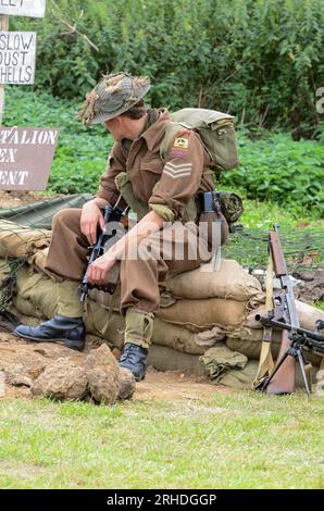 Second World War re-enactor wearing Essex Regiment British Army uniform and equipment at re-enactment event at Damyns Hall, Essex, UK Stock Photo