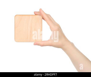 Hand holds blank wooden plaque on white background close-up Stock Photo