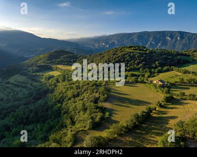 Aerial view of the surroundings of the town of Peramea in a summer sunrise (Pallars Sobirà, Lleida, Catalonia, Spain, Pyrenees) Stock Photo