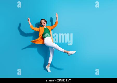 Full size cadre of youngster business investor woman celebrate her startup growing progress dancing isolated on blue color background Stock Photo