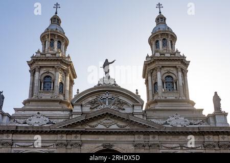 The twin bell towers and statue of Mary on the Metropolitan Cathedral of Santiago in Santiago, Chile. Stock Photo