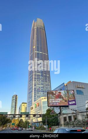 The Gran Torre Santiago in the Costanera Center with the moon over the Titanium La Portada Tower behind.  Providencia, Santiago, Chile. Stock Photo