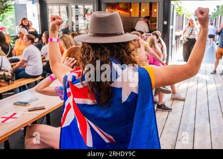 London, UK. 16th Aug, 2023. An ausie fan from Sydney may be outnumbered but makes up for it in passion - Fans in the Boxpark Shoreditch to watch the Lionesses in the the England v Australia, FIFA World Cup semi final. Credit: Guy Bell/Alamy Live News Stock Photo