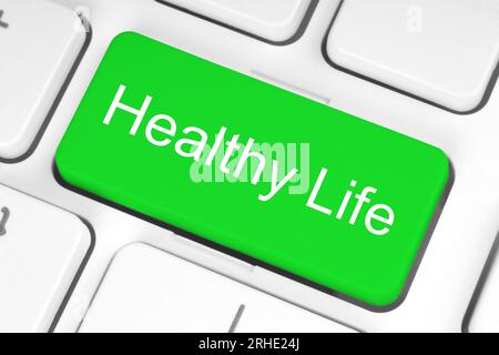 Green button with Healthy Life words on the keyboard close-up, healthy concept Stock Photo